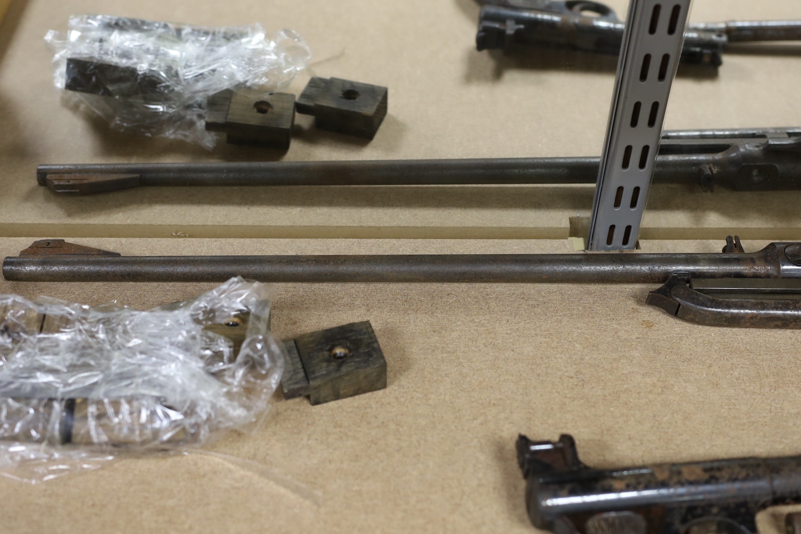 Two Webley air pistols, another, an air rifle and a part rifle